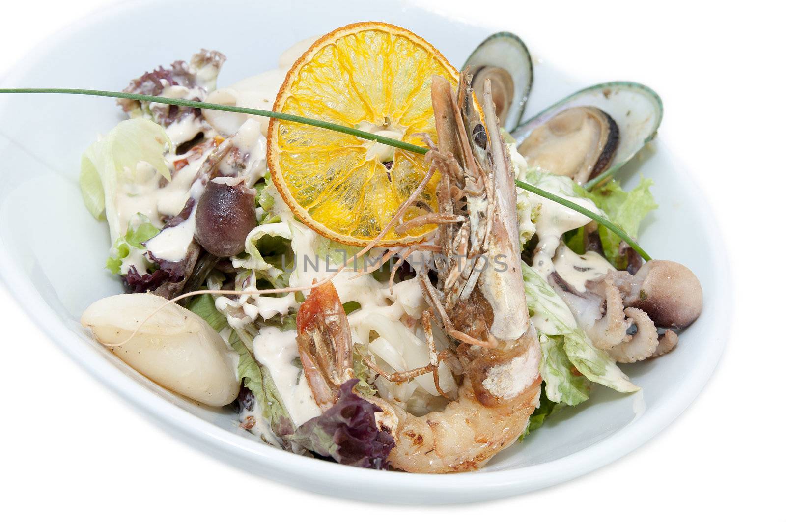 salad with seafood in a restaurant on a white background