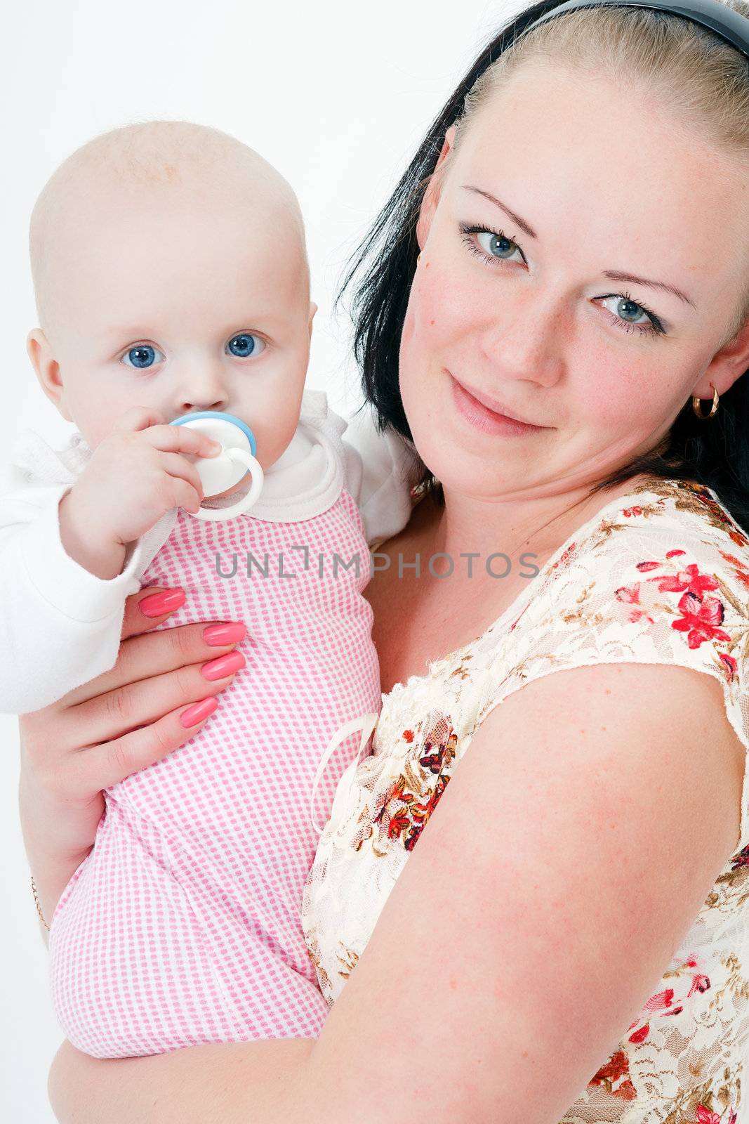 mother holding a baby daughter. studio photography