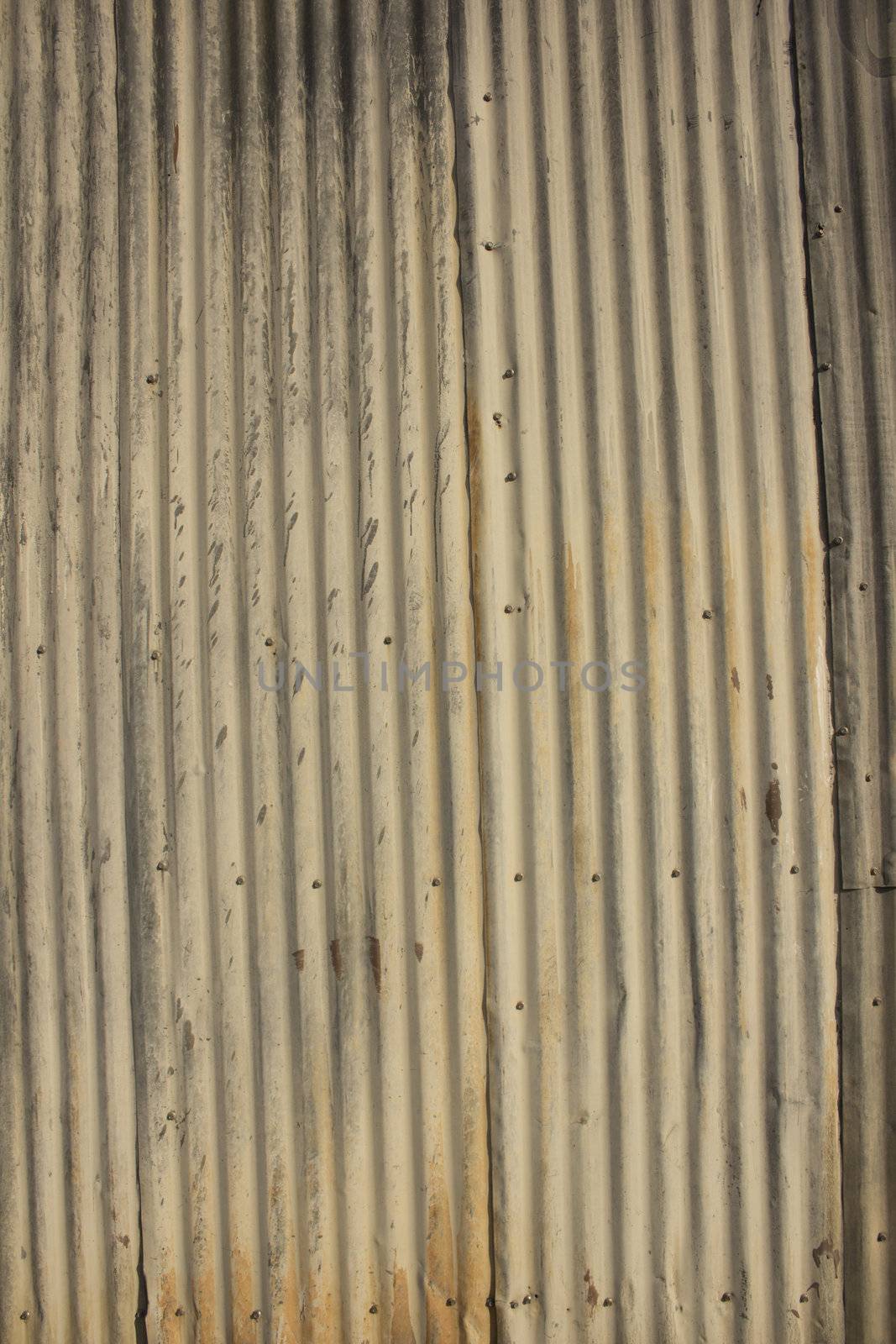 Rusty damaged corrugated metal surface texture. by jeremywhat