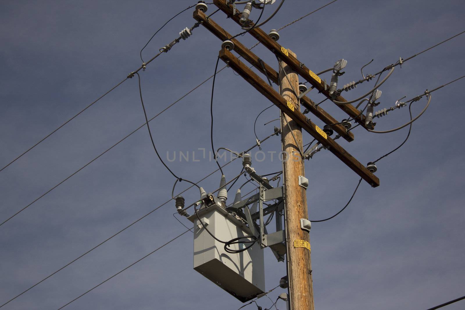 Power pole with a blue sky background by jeremywhat