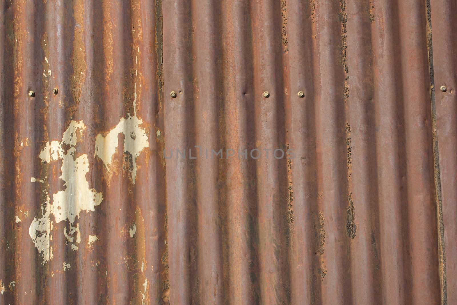 an old rusty damaged piece of metal roofing