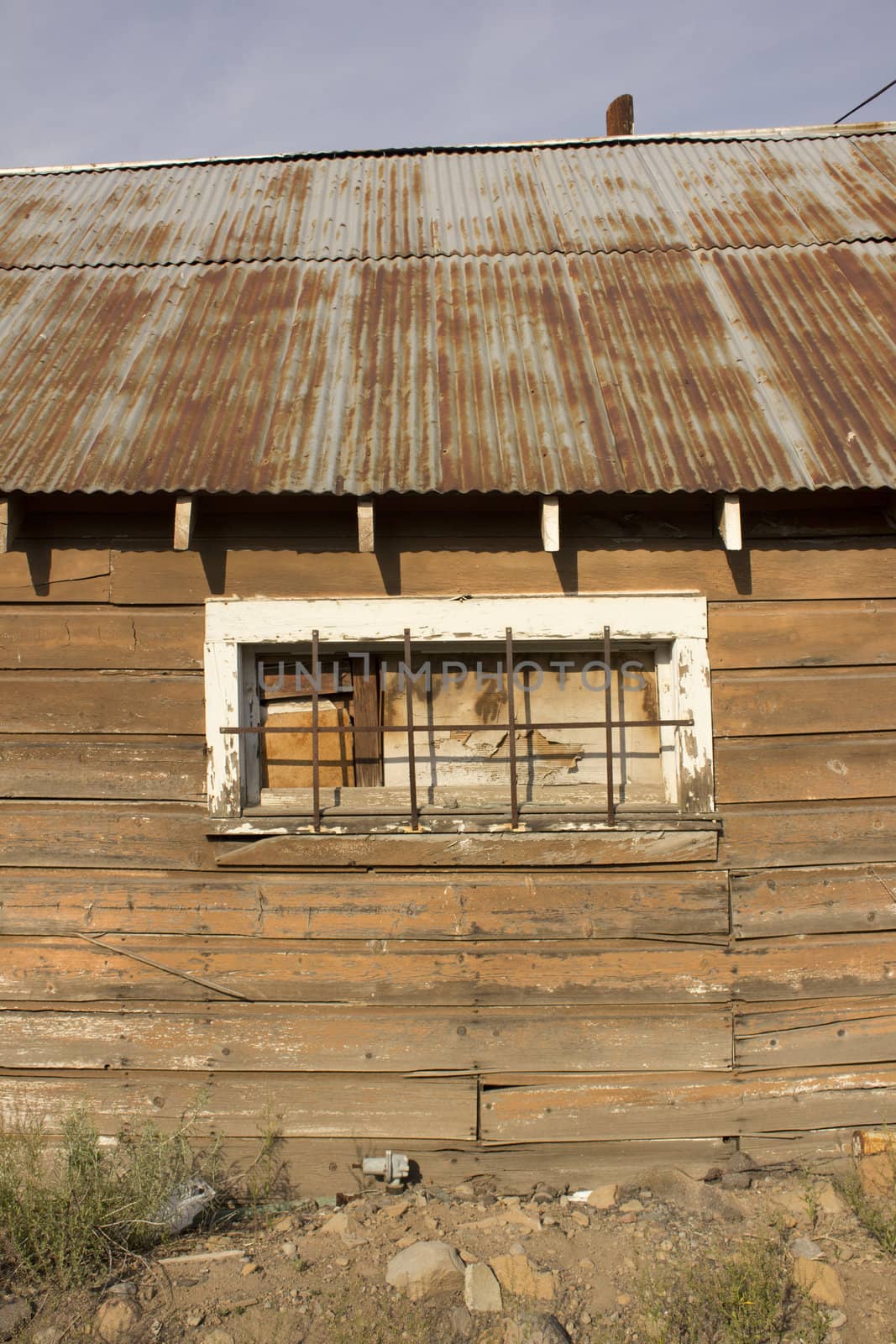 Rusty old shack with a cloudy dark day background