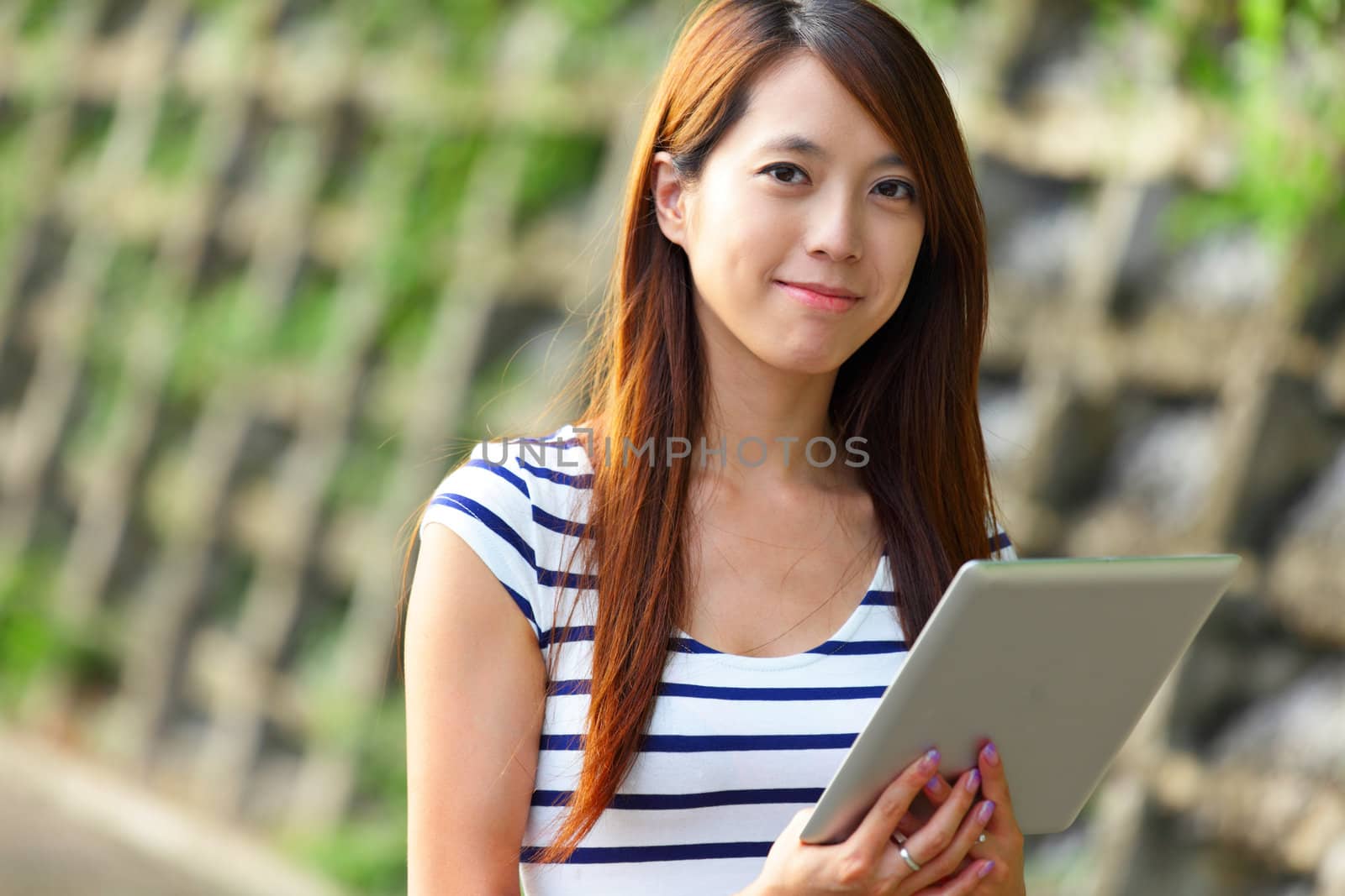 woman using tablet computer by leungchopan