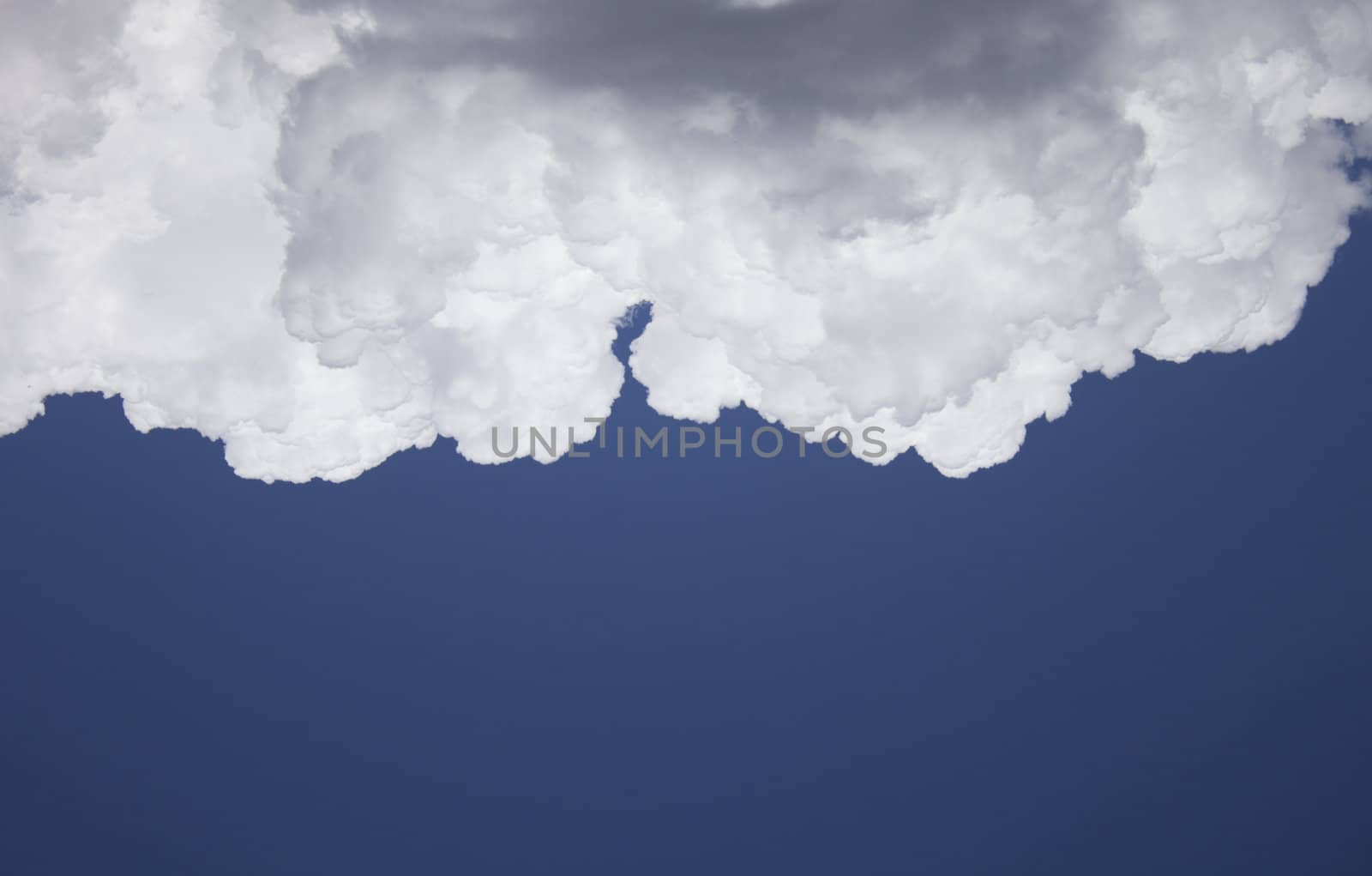 Dramatic Cloudy Sky with a deep blue background.