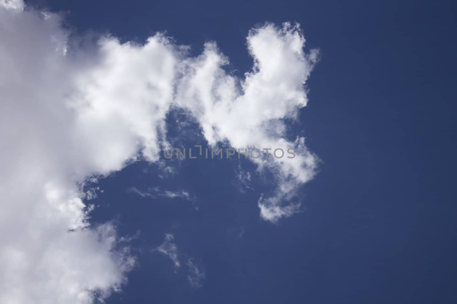 Dramatic Cloudy Sky with a deep blue background.