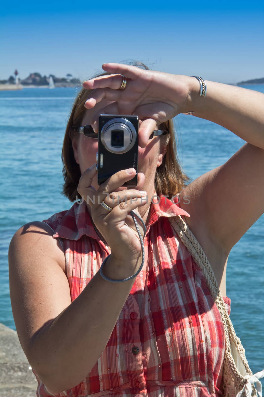 A Woman on holiday taking Photographs