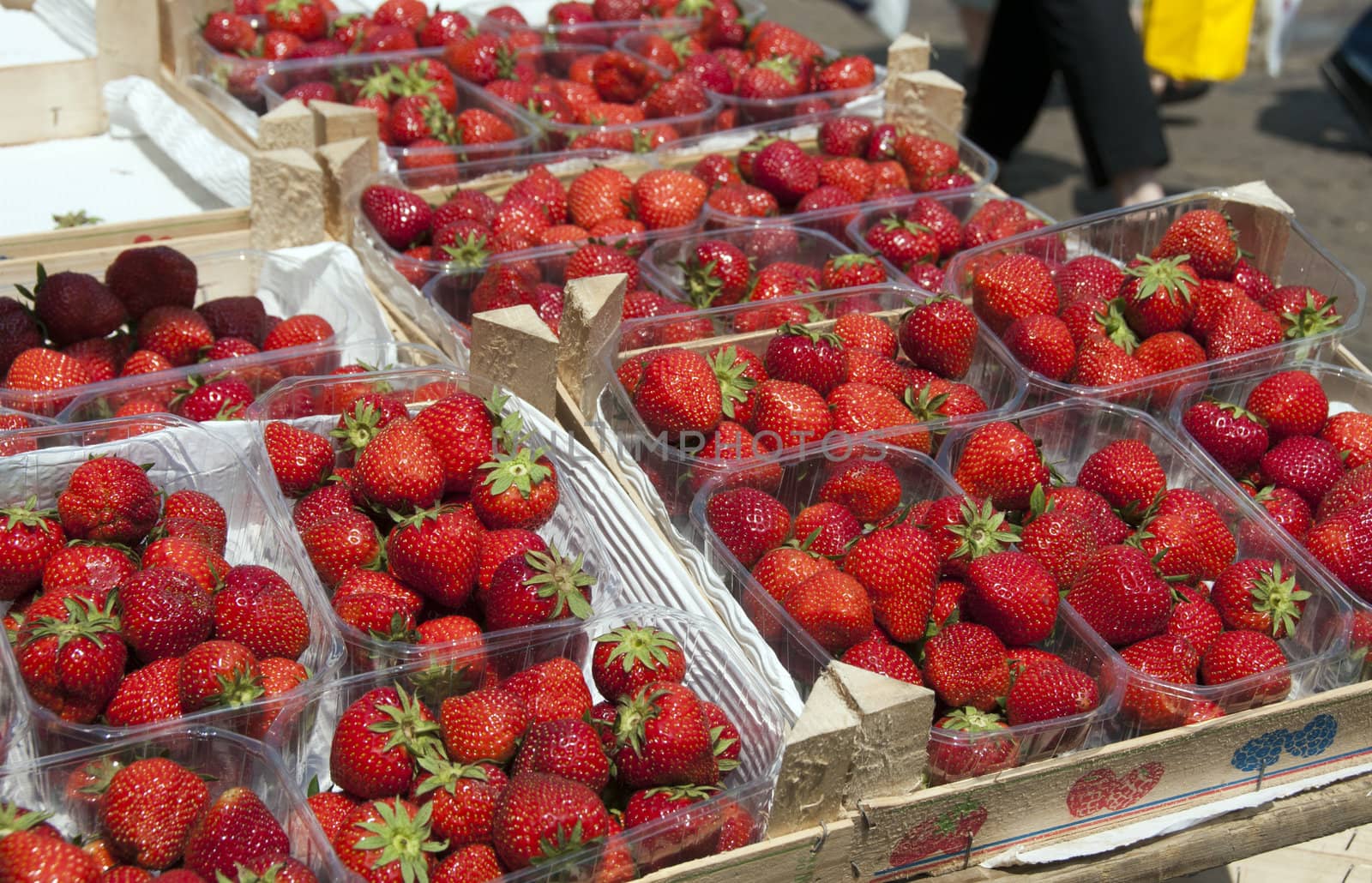 lot of red strawberries on the market