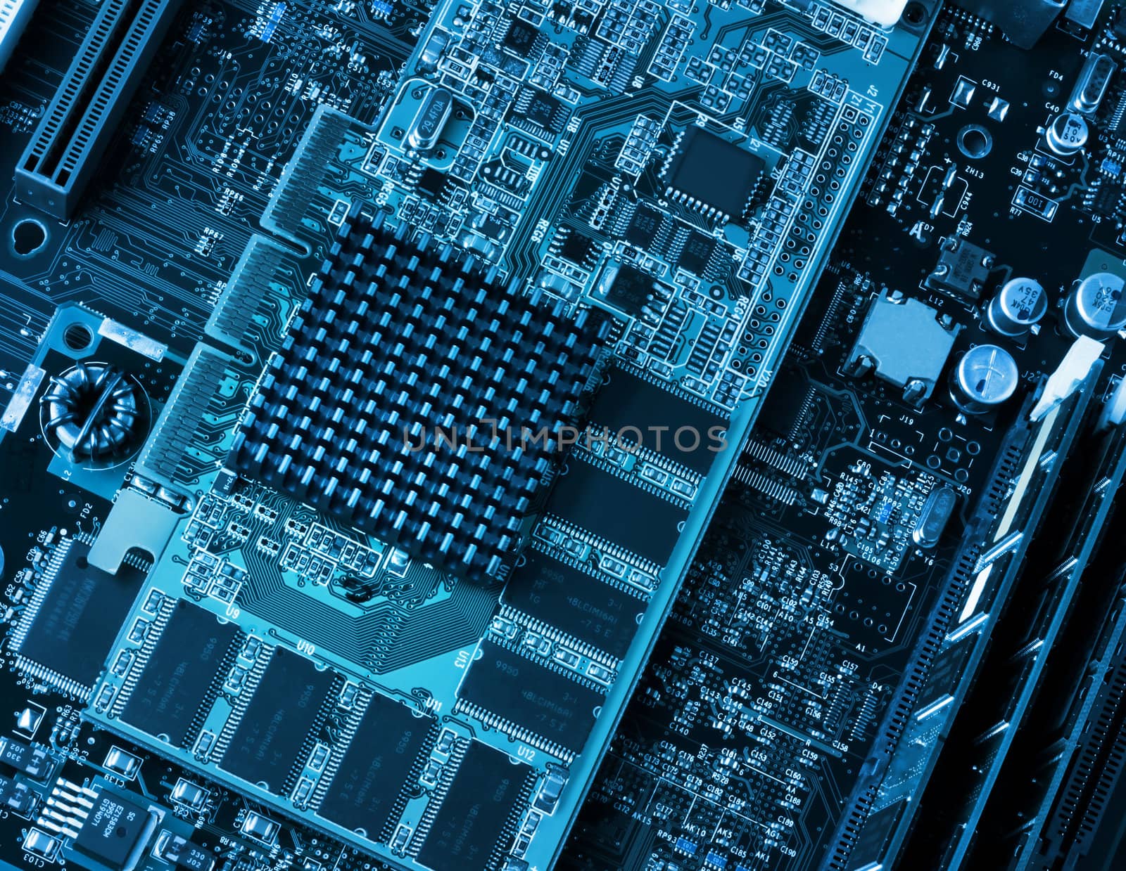 Computer components circuit board and processors closeup blue