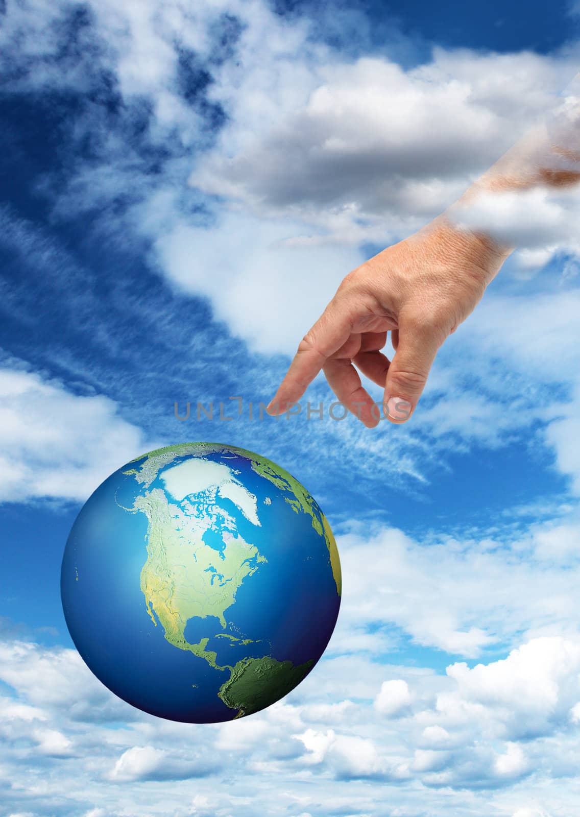 Male hand reaching to touch planet Earth, blue sky background