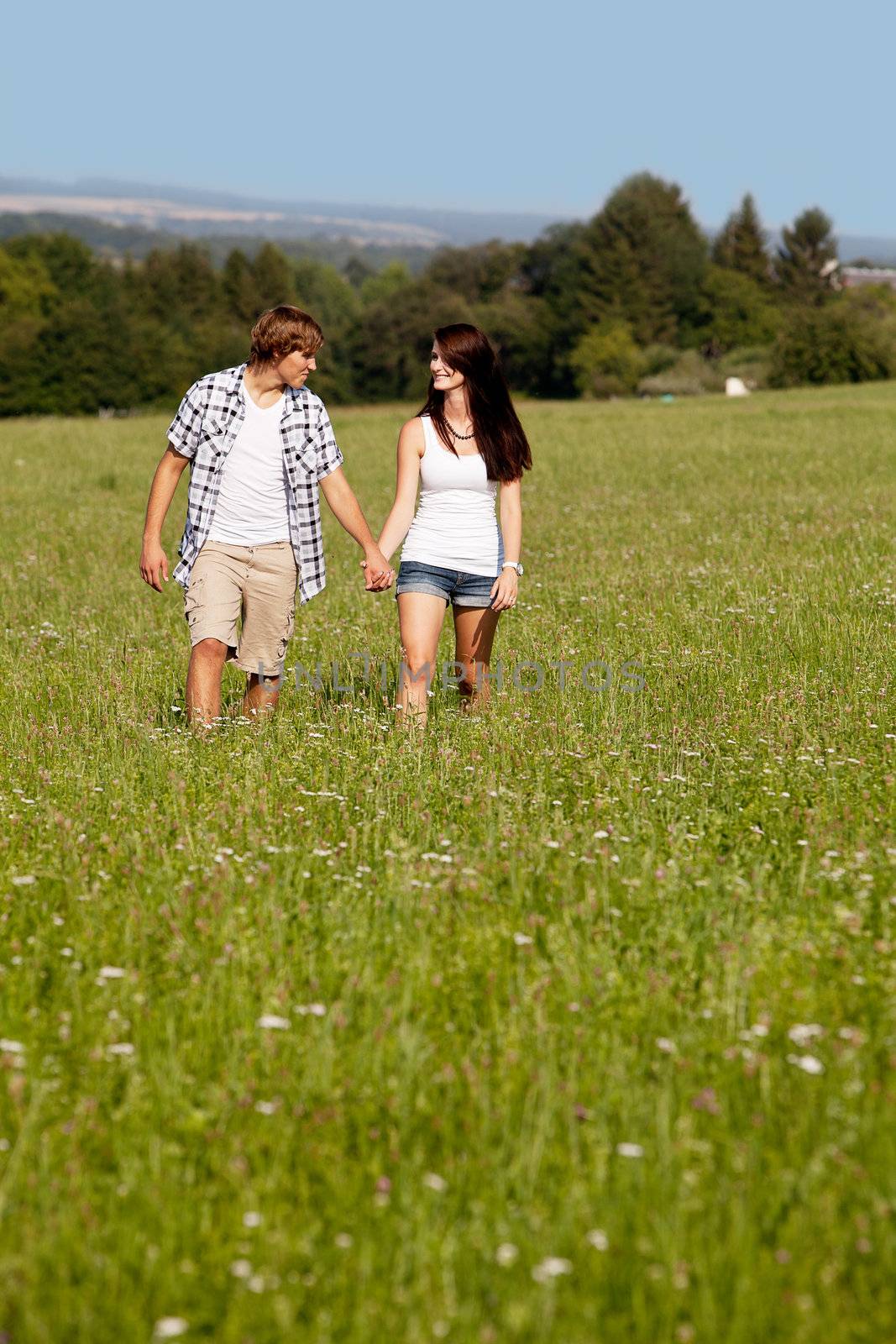 young love couple smiling outdoor in summer having fun