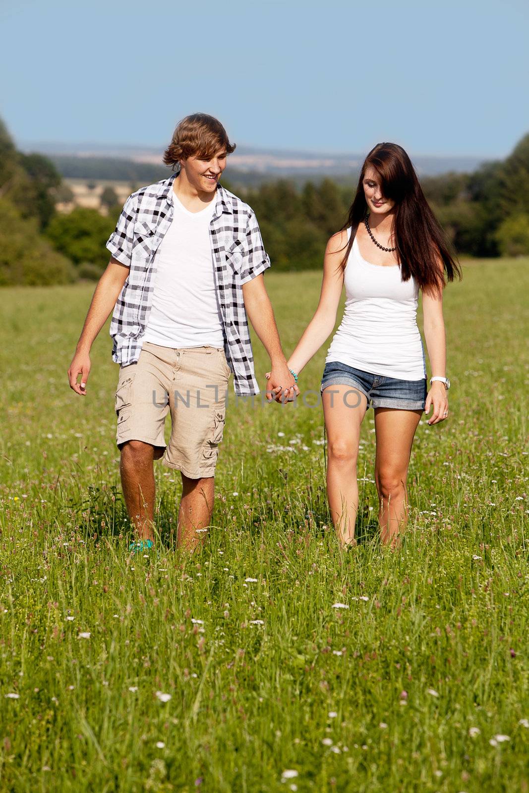 young love couple smiling outdoor in summer having fun