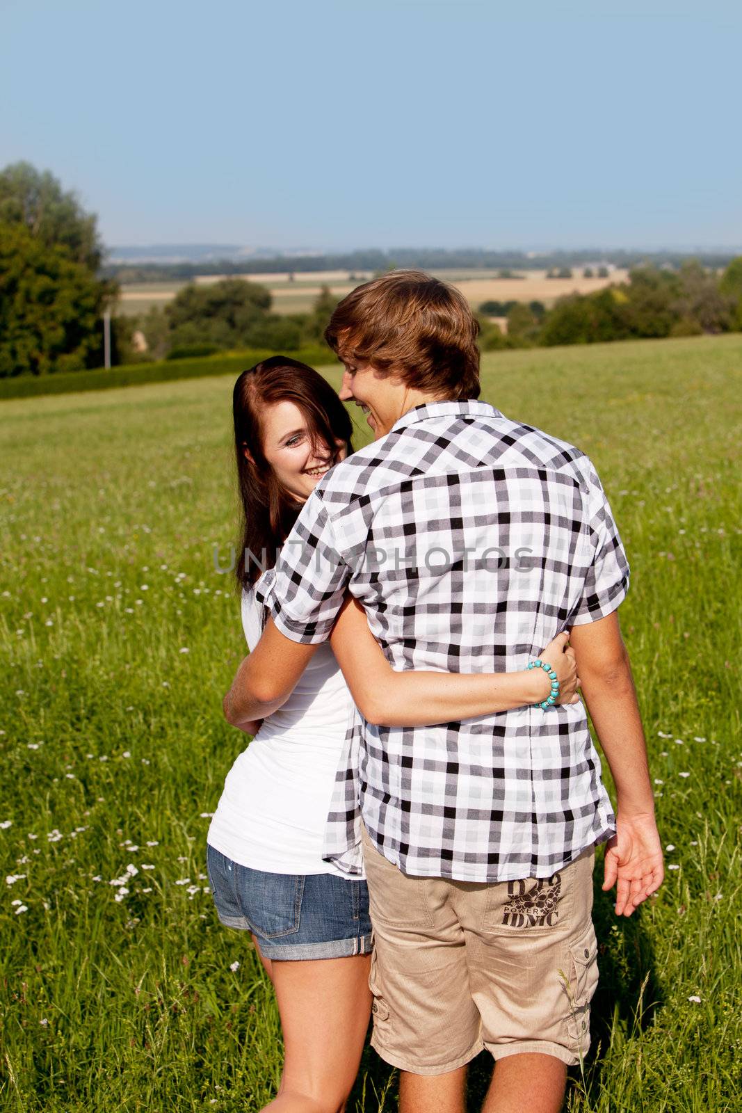 young love couple smiling outdoor in summer  by juniart