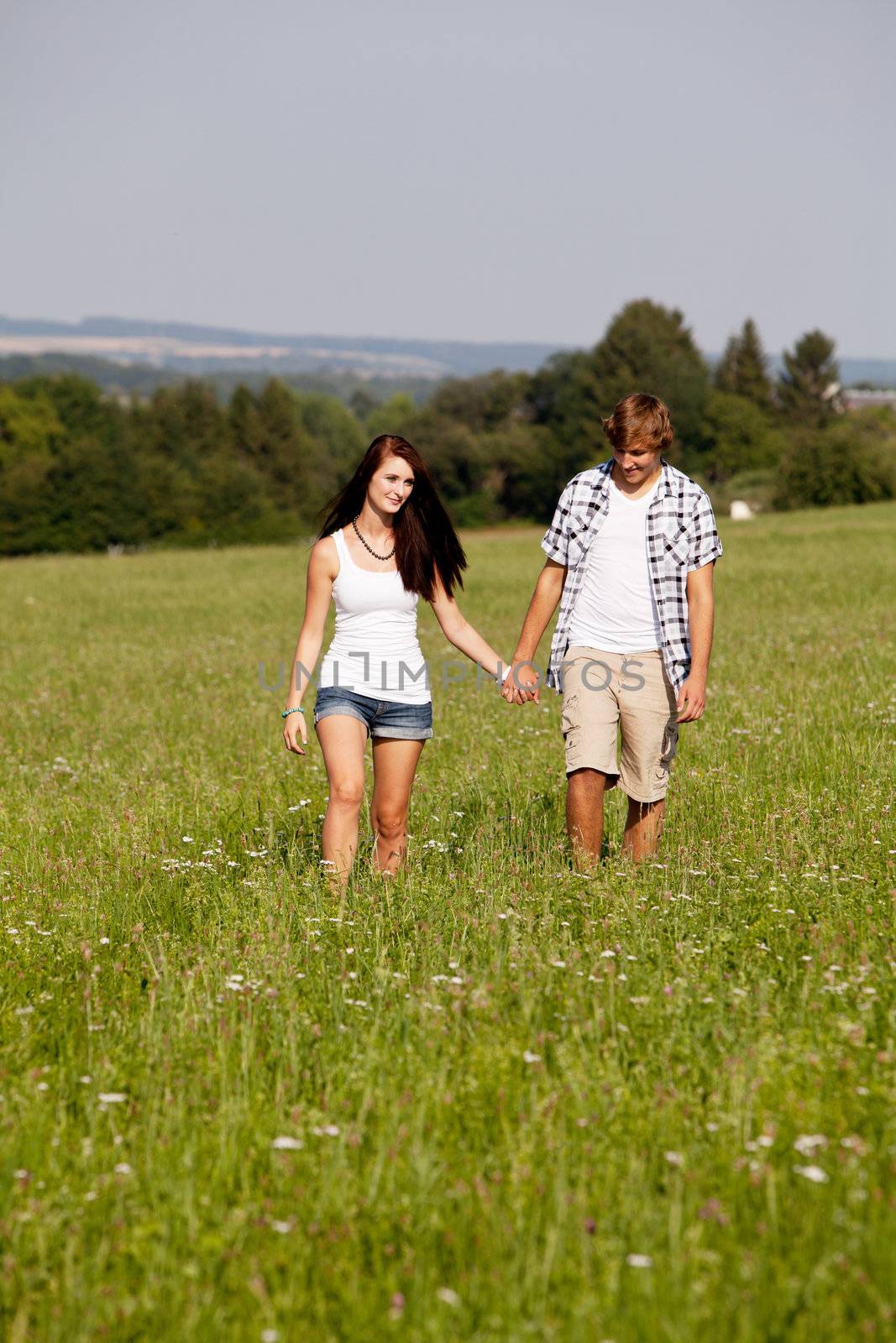 young love couple smiling outdoor in summer having fun