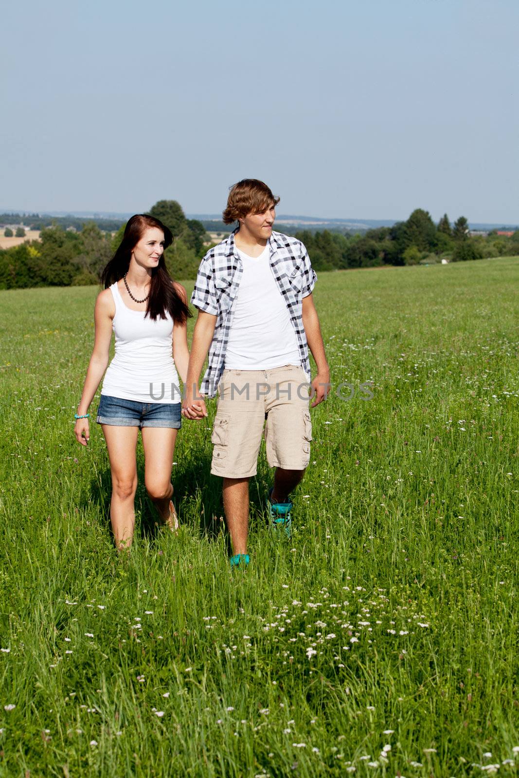 young love couple smiling outdoor in summer having fun