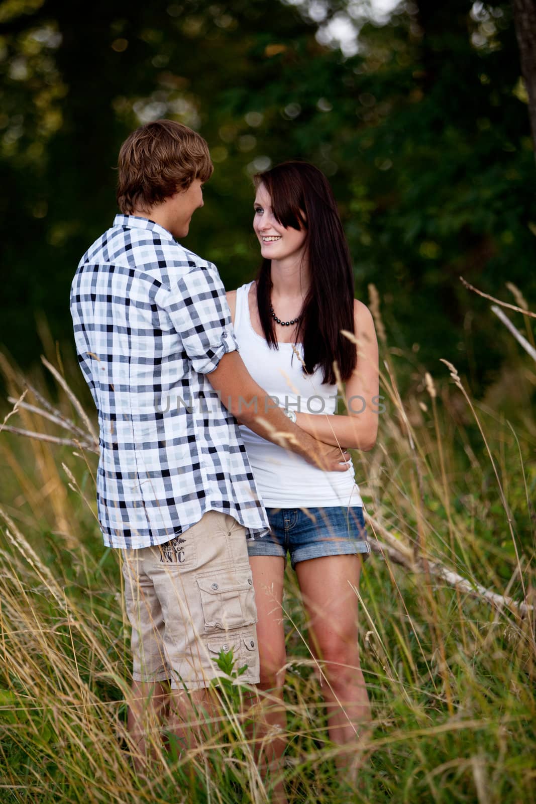 young love couple smiling outdoor in summer having fun