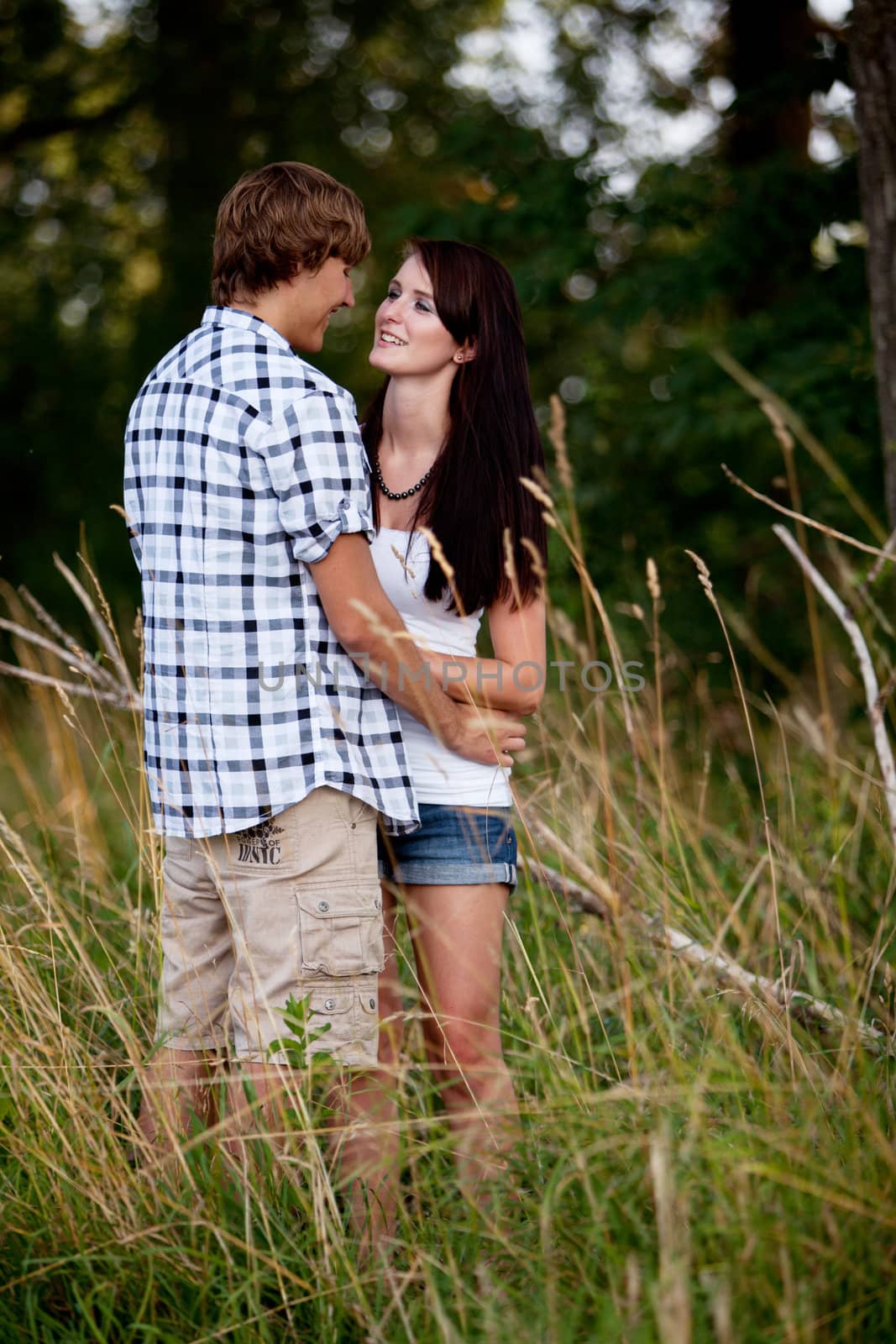 young love couple smiling outdoor in summer having fun