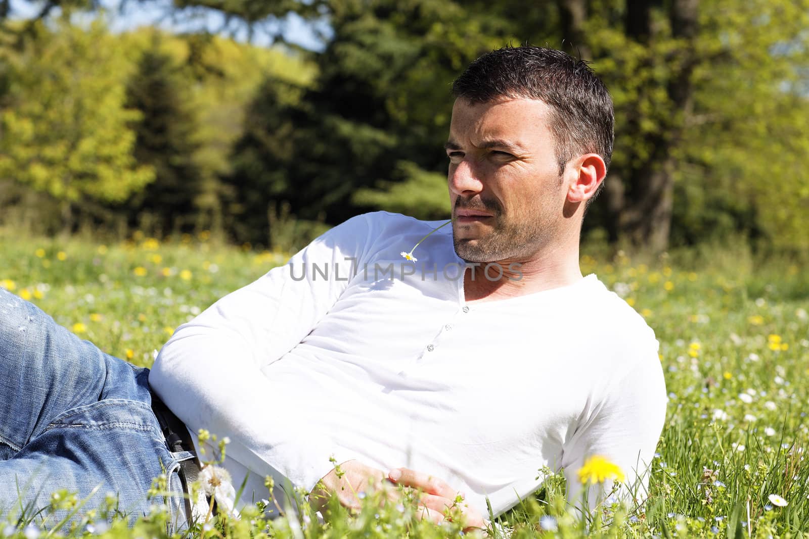 young man on the grass in a park