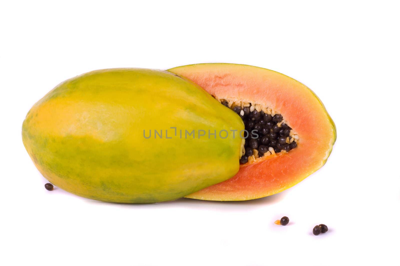 Close up view of a tropical papaya fruit isolated on a white background.