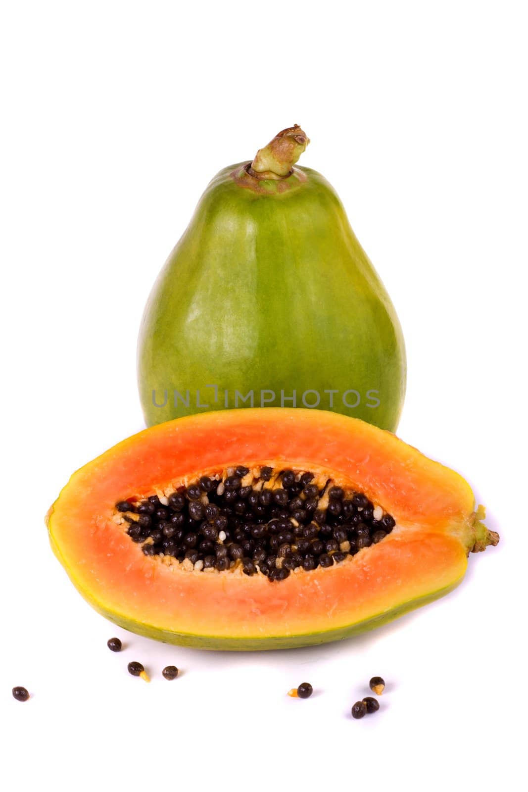 Close up view of a tropical papaya fruit isolated on a white background.