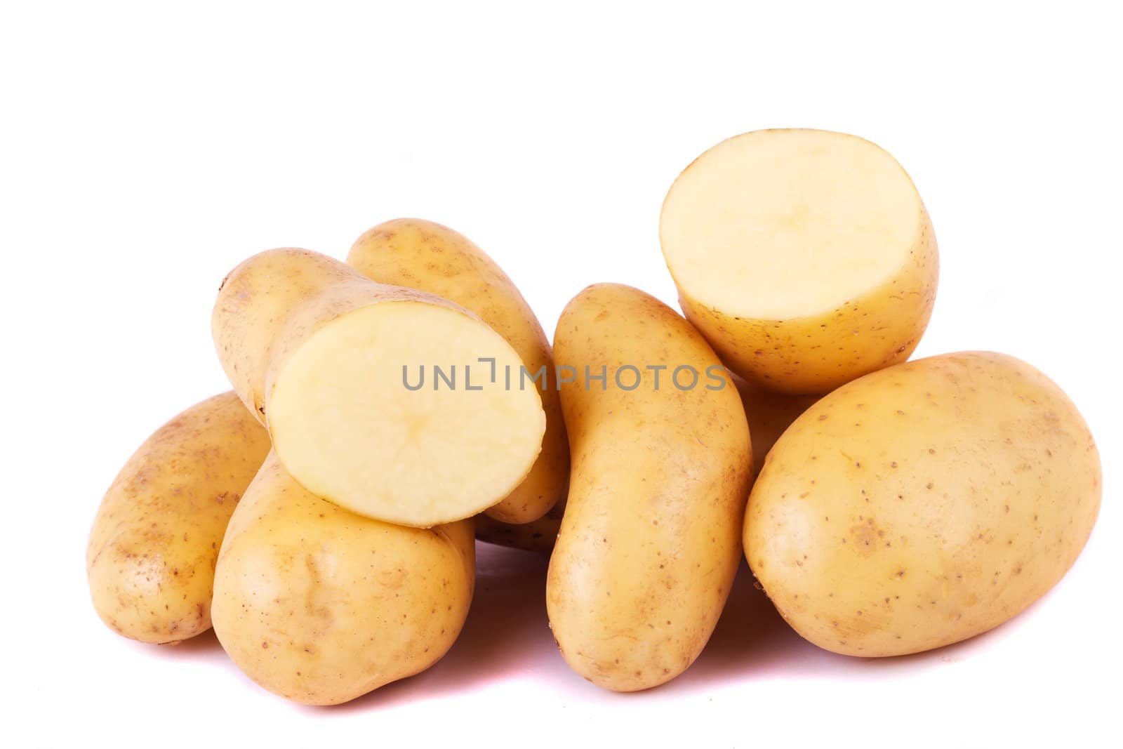 Close up view of some potatoes isolated on a white background.