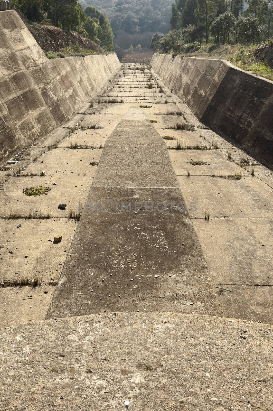 Concrete rundown overflow spillway in an old dam