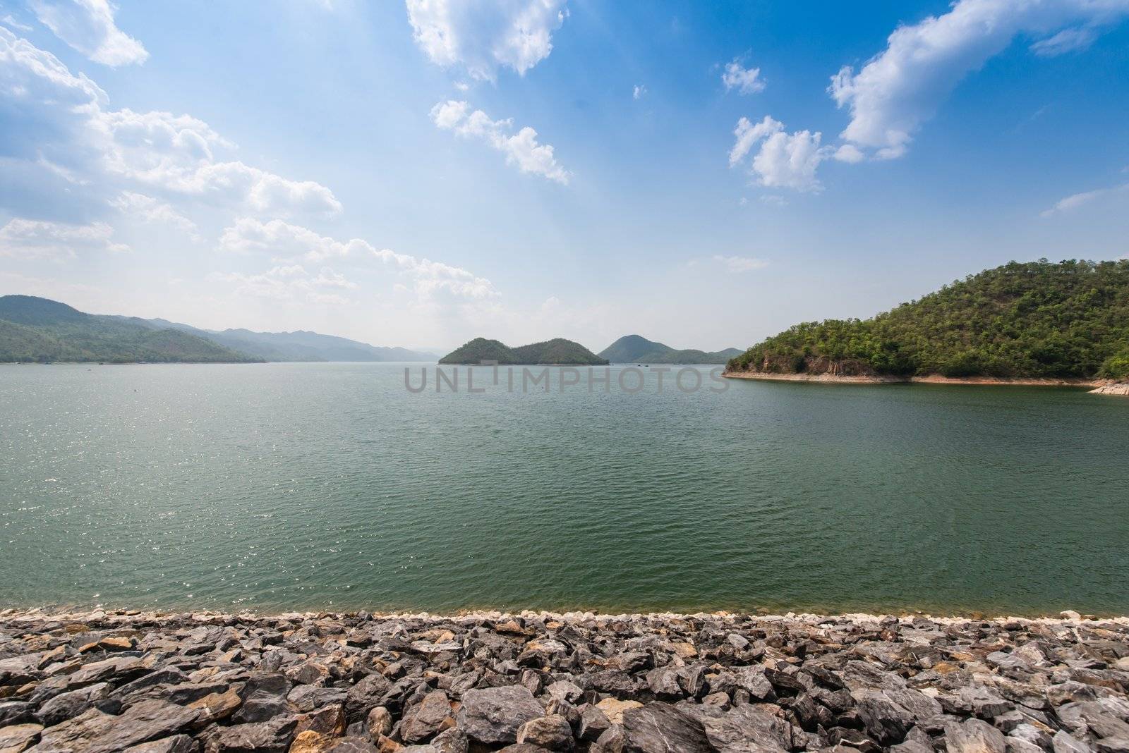 A man made lake as a result of a dam setting up in Thailand, taken on a cloudy day
