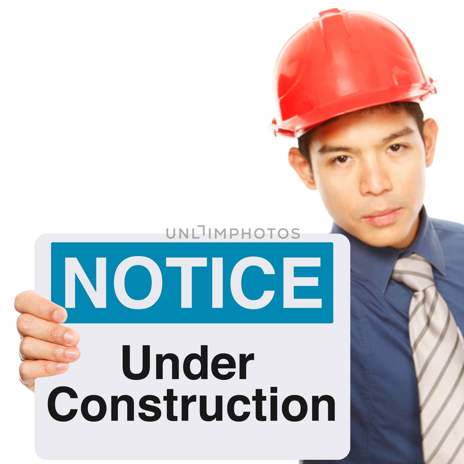 A man holding a safety sign indicating on-going repair or construction