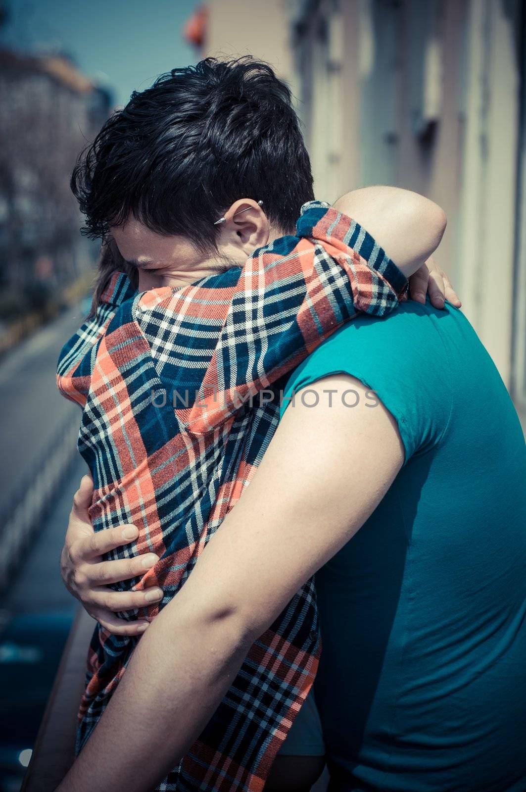 couple embracing on balcony