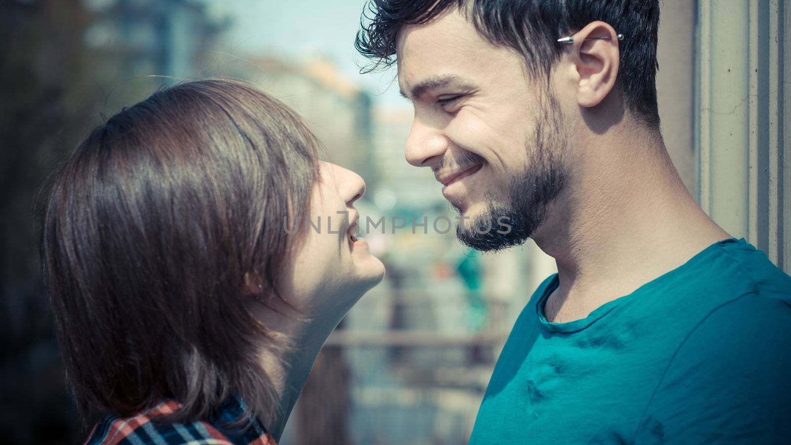 couple embracing on balcony