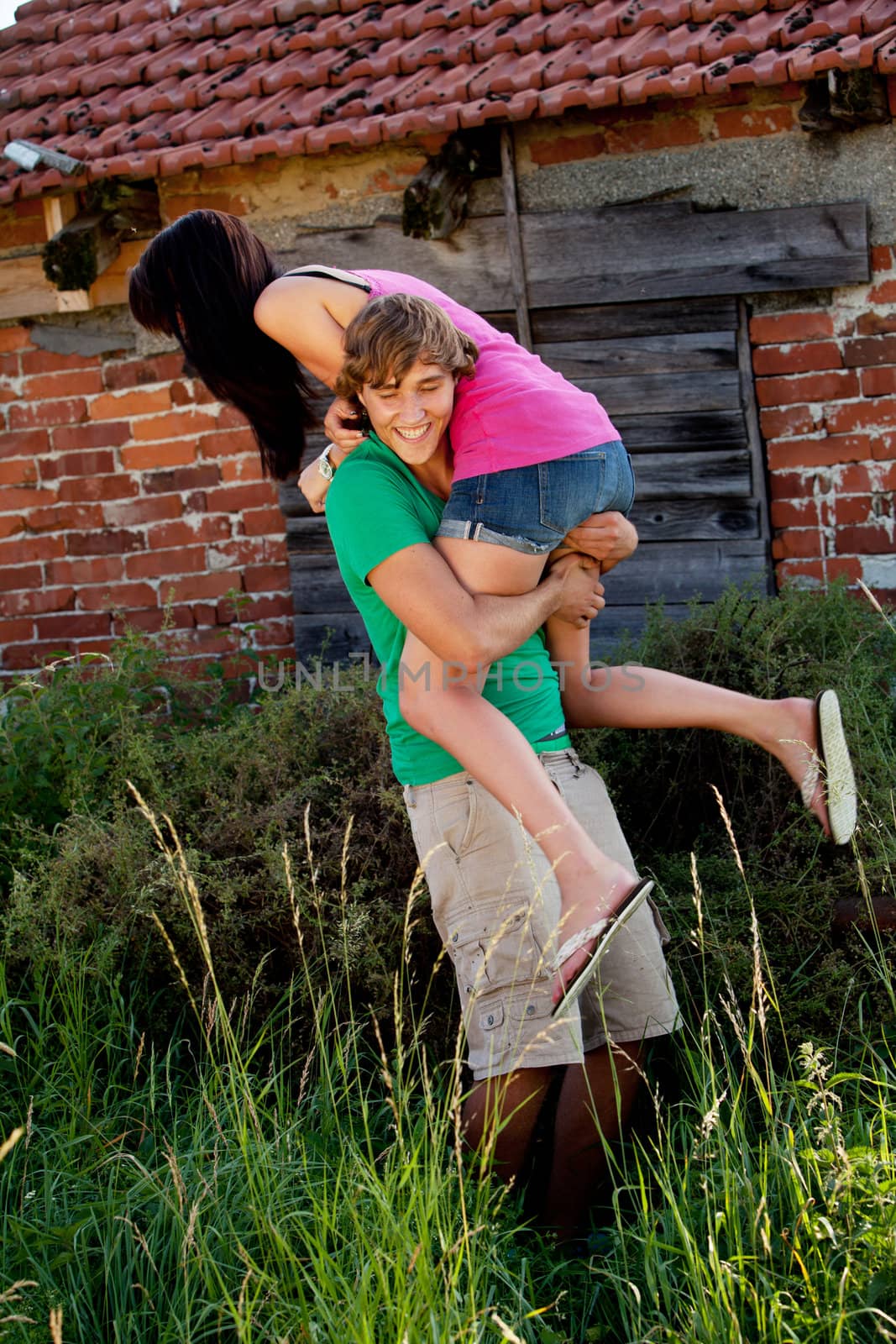 young couple in love smiling and having fun in summer outdoor 