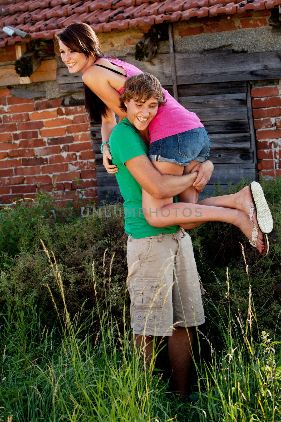 young couple in love smiling and having fun in summer outdoor 