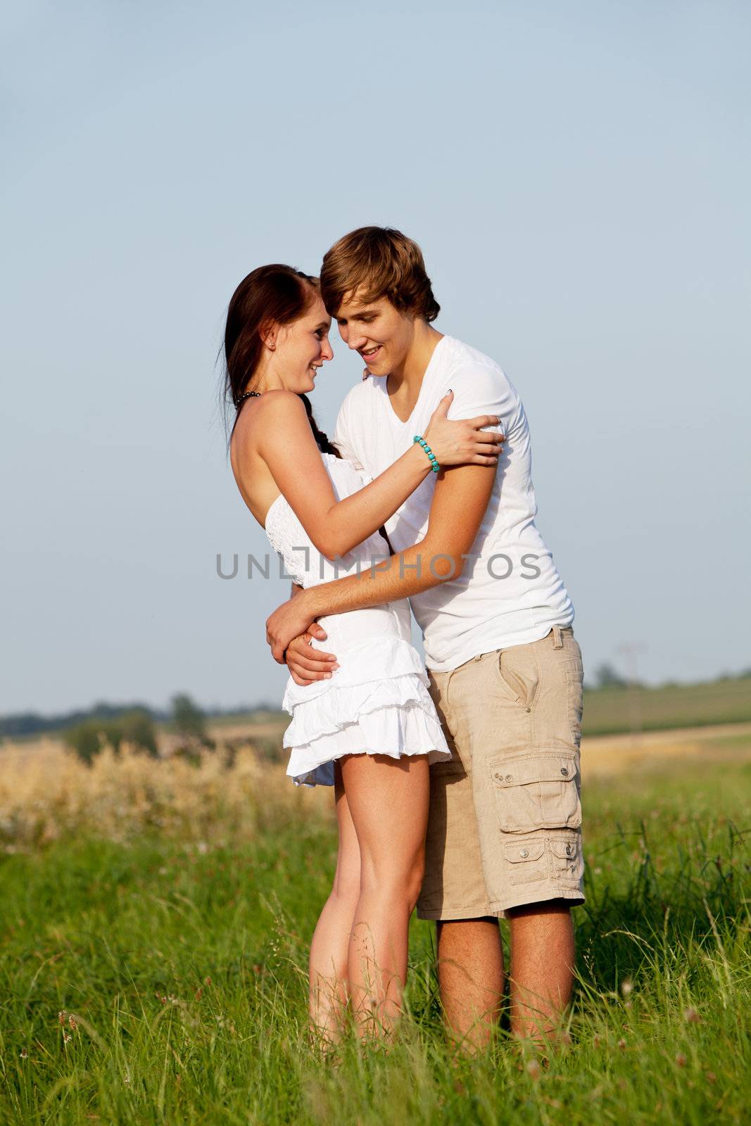 young love couple smiling outdoor in summer having fun