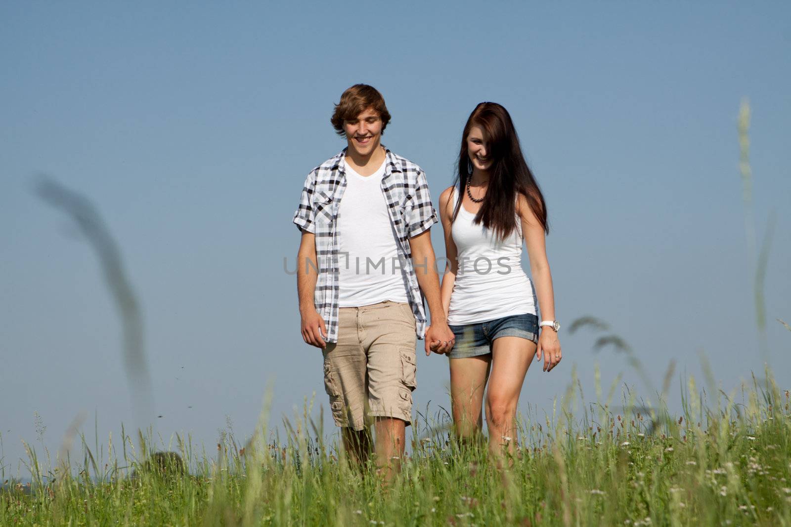 young love couple smiling outdoor in summer having fun