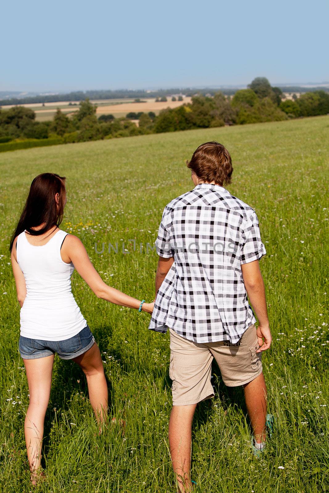 young love couple smiling outdoor in summer having fun