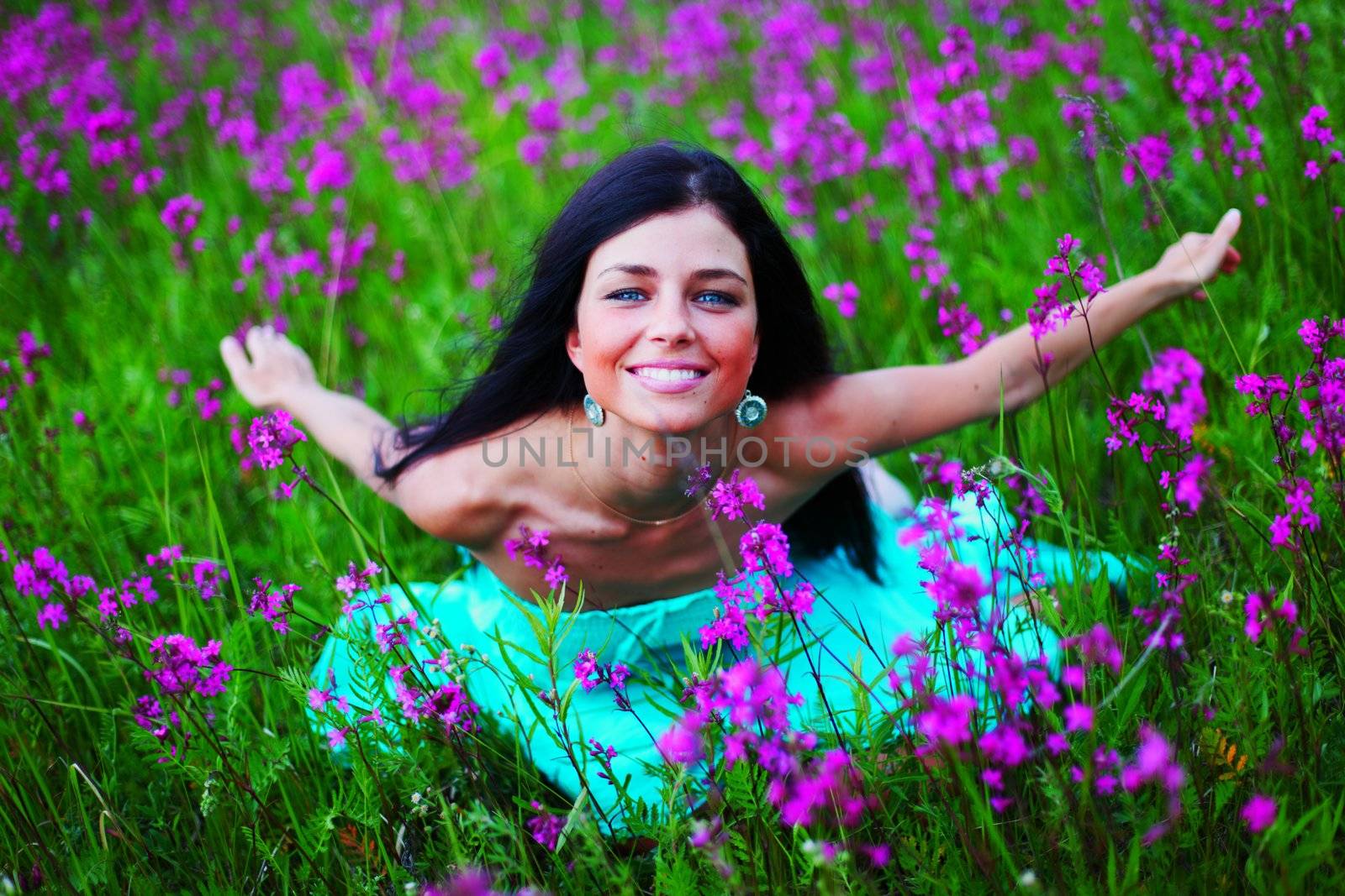 woman on summer flower field