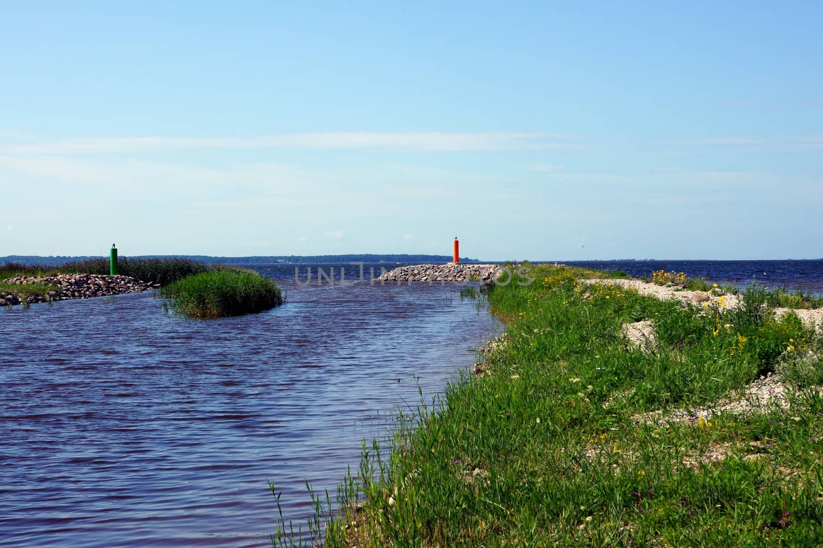 Channel for boats on a background of the blue sky