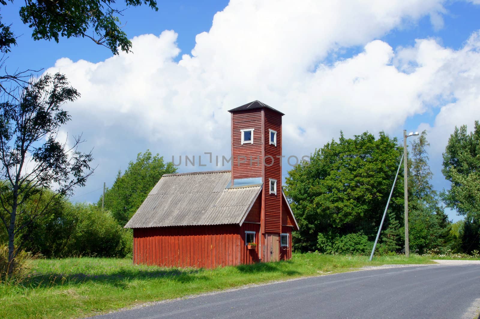 Old fire tower on a background of trees