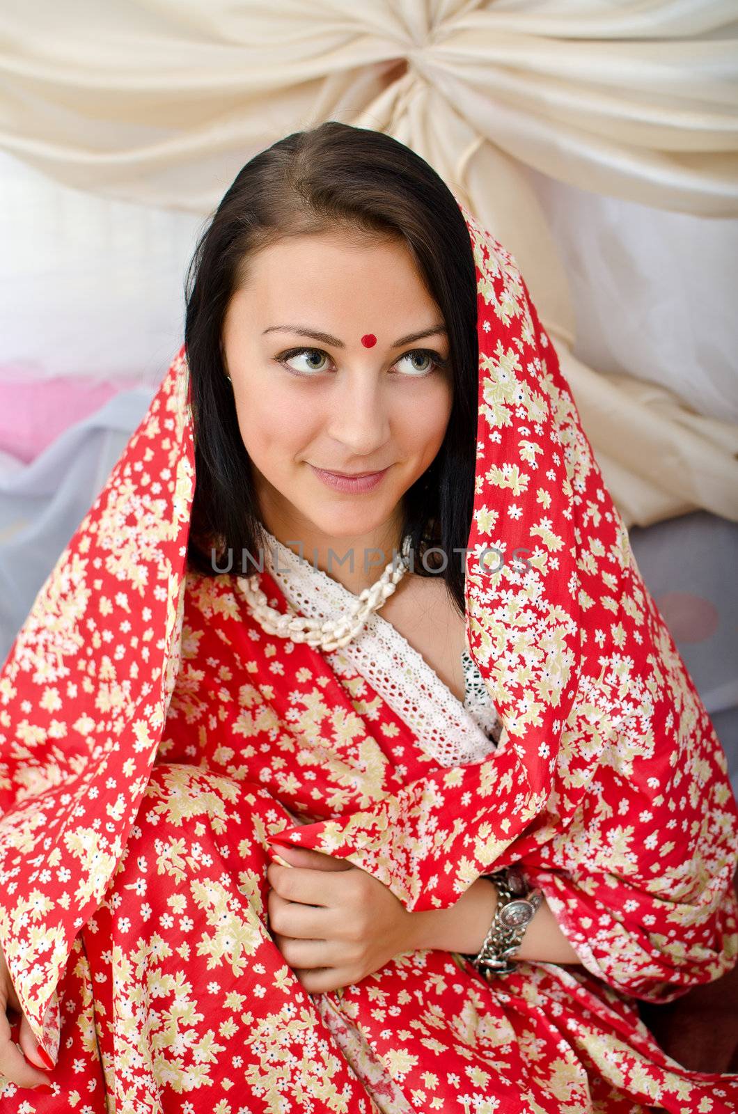 Young Indian girl in traditional red clothing