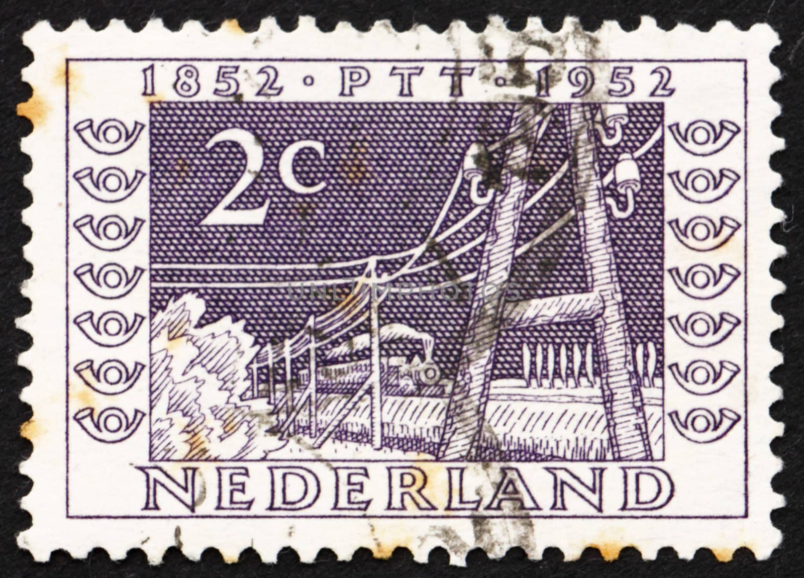 NETHERLANDS - CIRCA 1952: a stamp printed in the Netherlands shows Telegraph Poles and Train of 1852, Centenary of the Telegraph Service, circa 1952