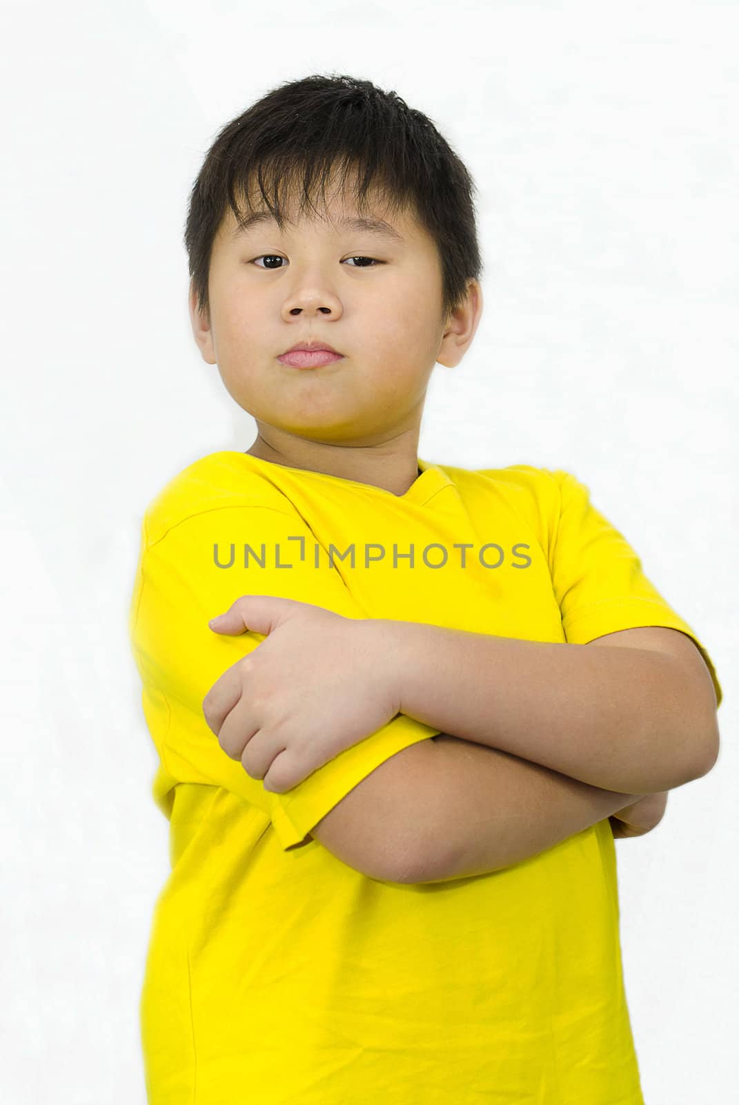 a confident boy with arms crossed