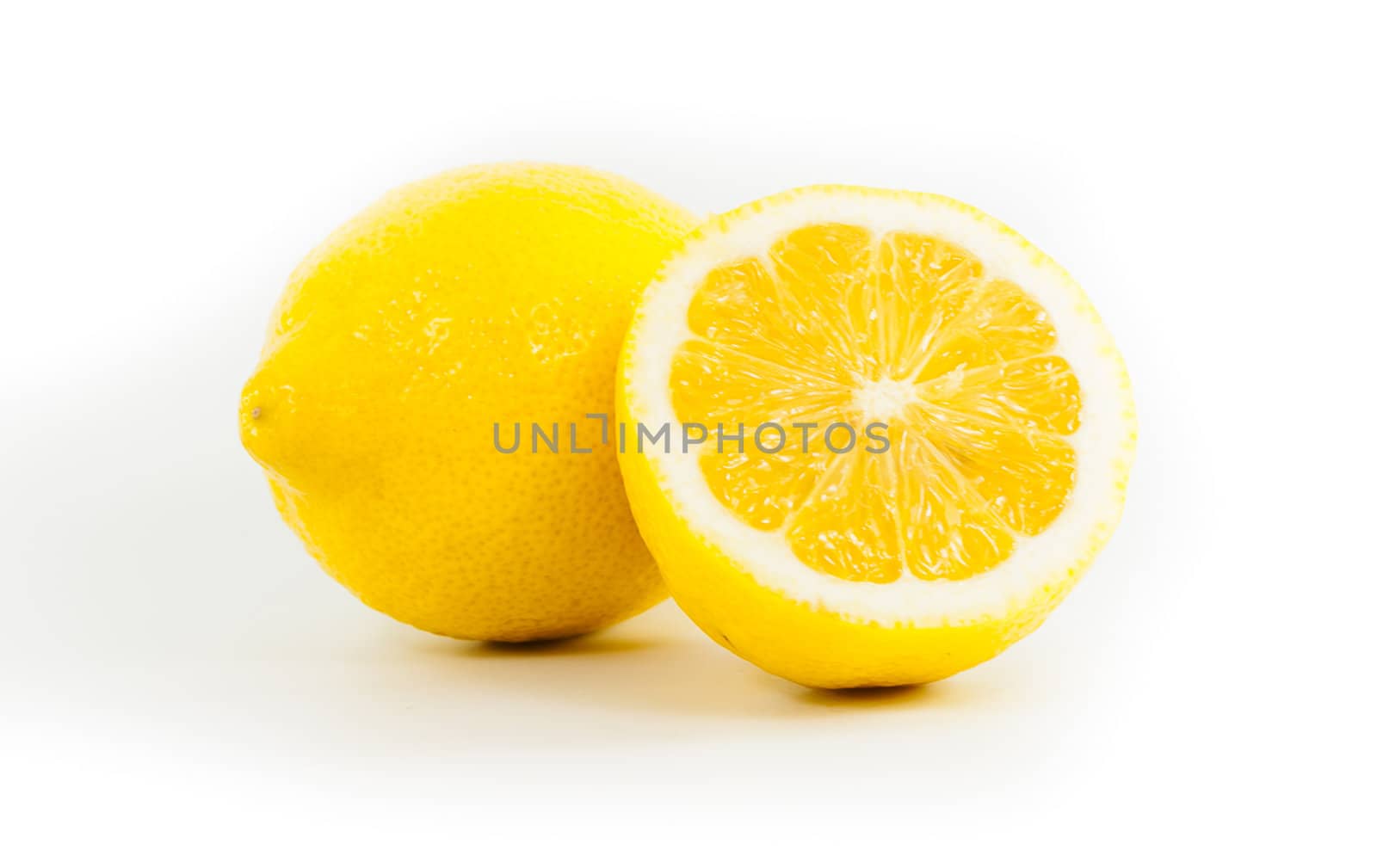 Yellow lemon on white background by moggara12