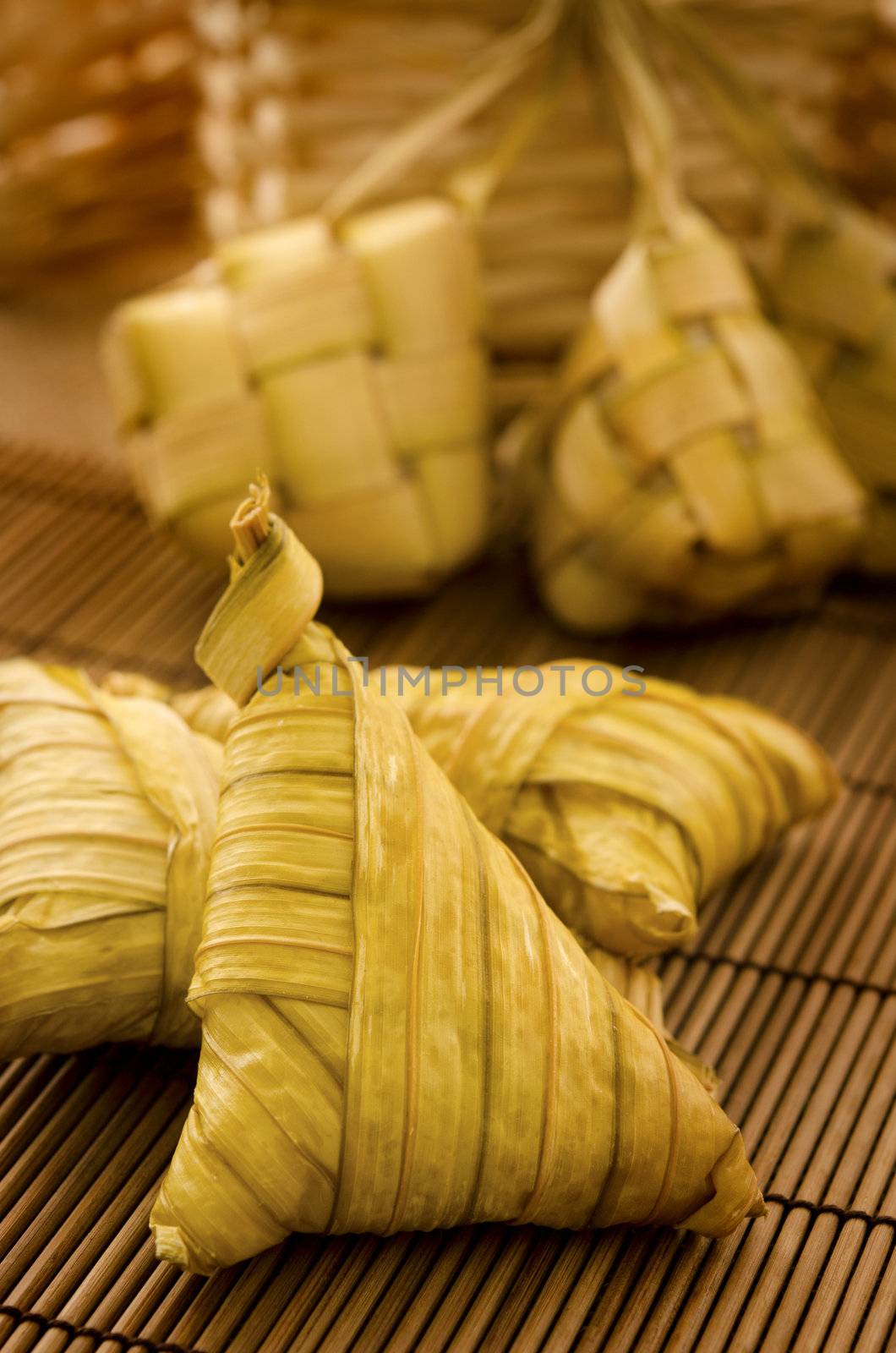 Traditional Asian Malay food, ketupat or packed rice in low light setting