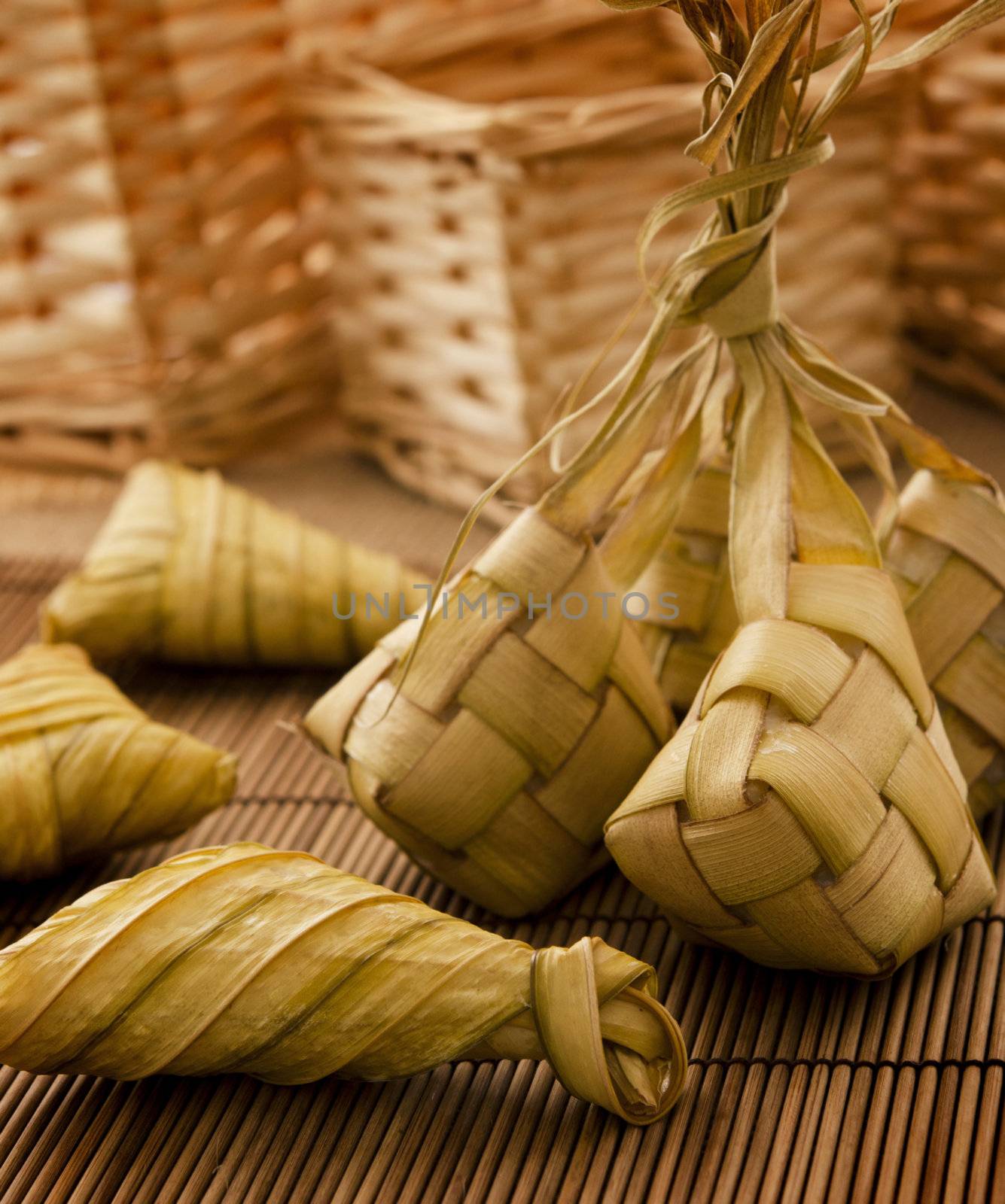 Asian cuisine ketupat or packed rice in low light setting.