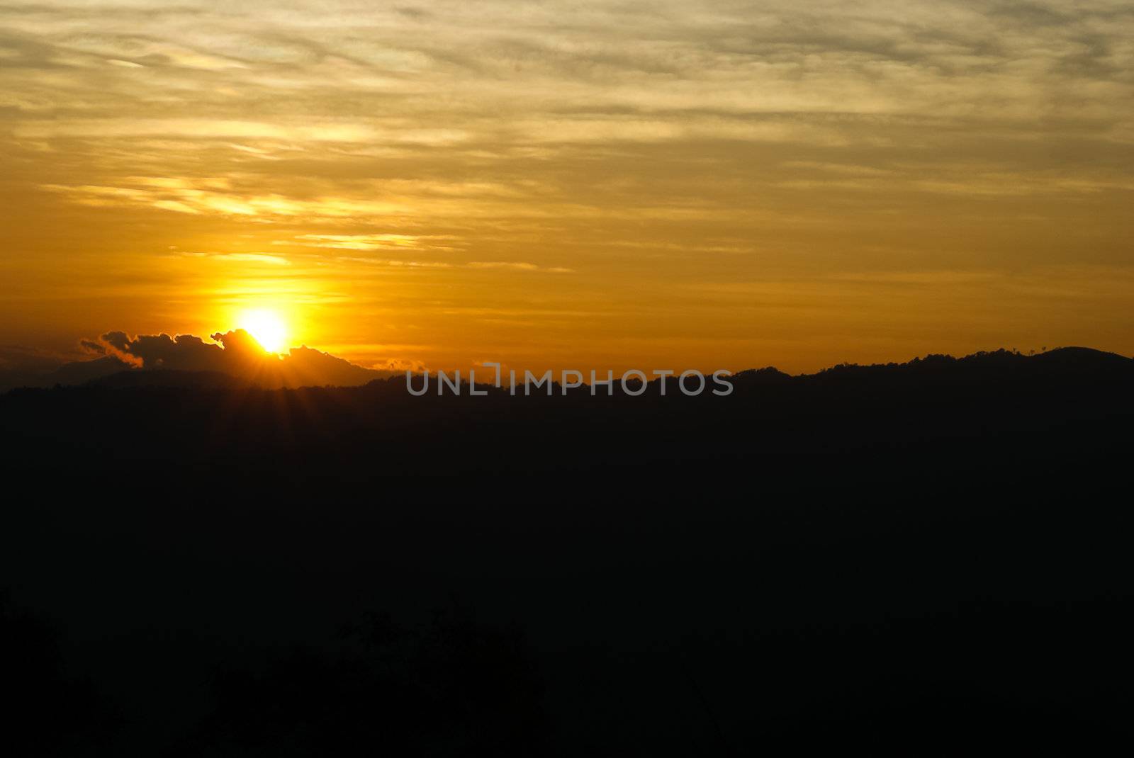 Sunset behind mountain in national Park  of thailand