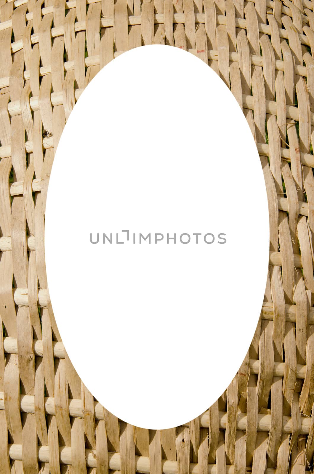 Isolated white oval place for text photograph image in center of frame. Wicker fragment background. Handmade interesting wooden backdrop.