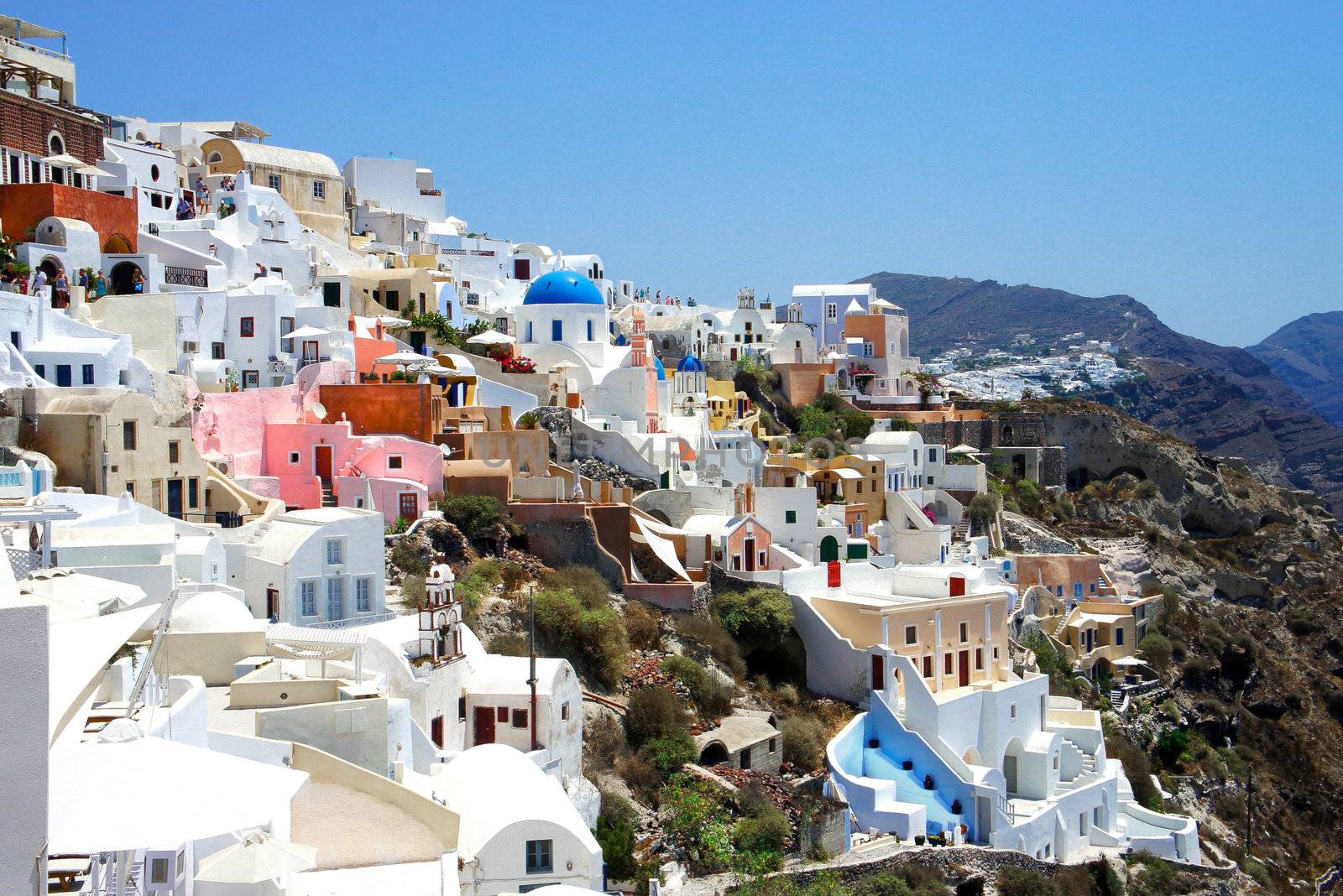 Amazing small white houses of Santorini, summer sunny day