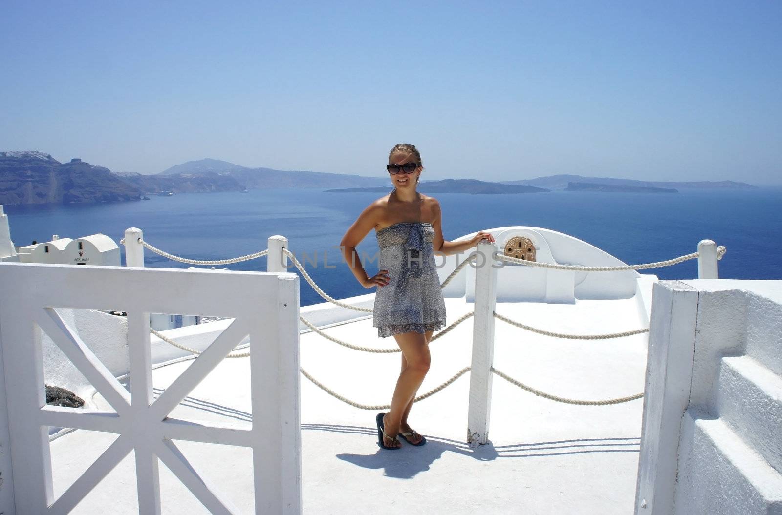 Young woman on Santorini, Greece                 