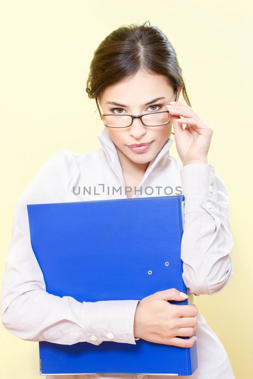 Portrait of a business woman with file and eyeglasses