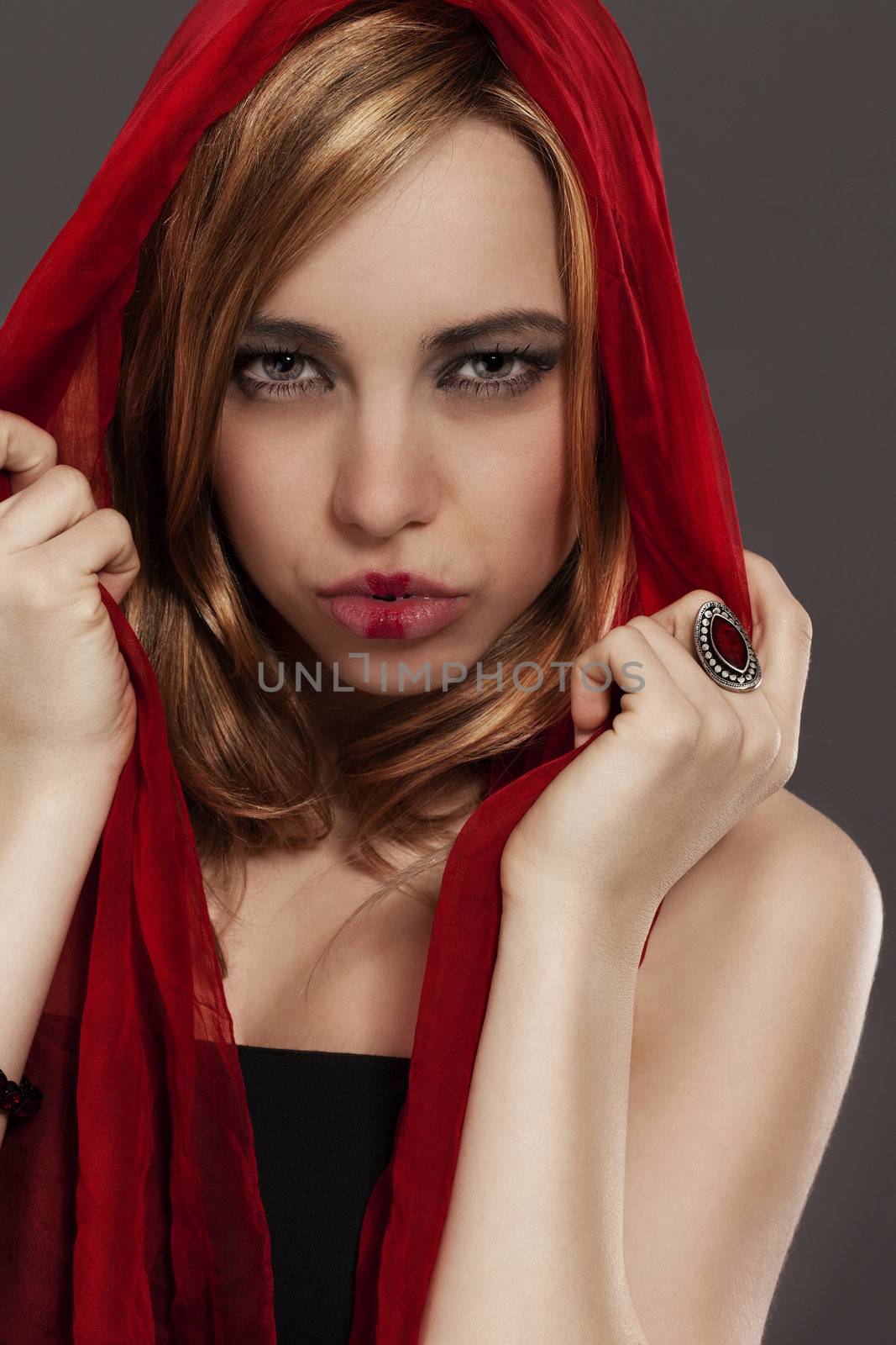 beautiful woman with a red scarf red riding hood like