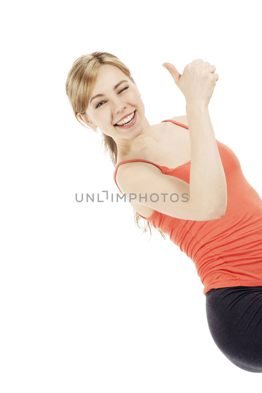blonde very happy fitness woman showing thumb up on white background